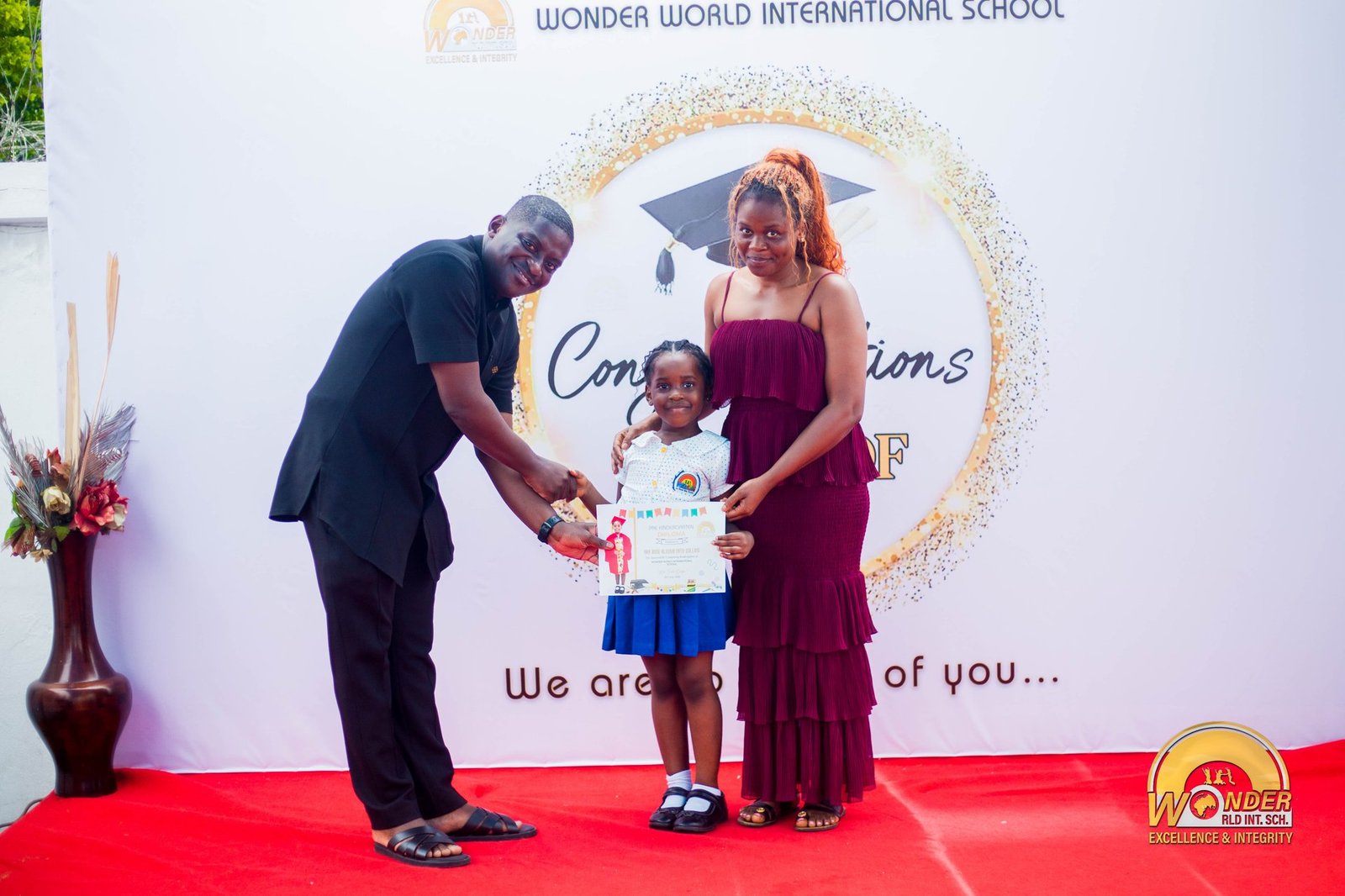 A family celebrating graduation day at WWIS